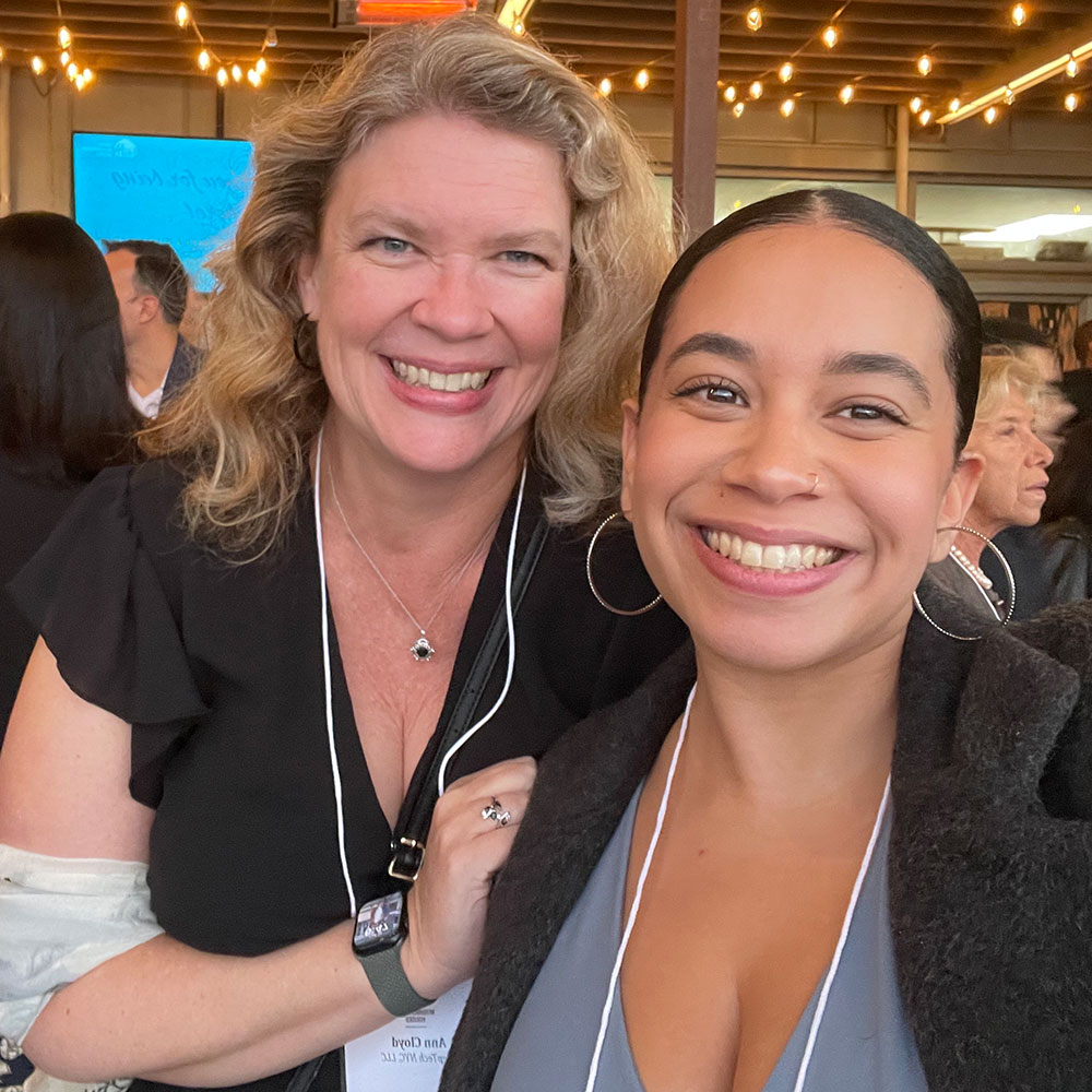 DeepTech founder Anne Cloyd with a young female employee, both smiling broadly