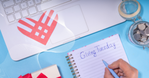 person writing a list of items to create a giving tuesday campaign
